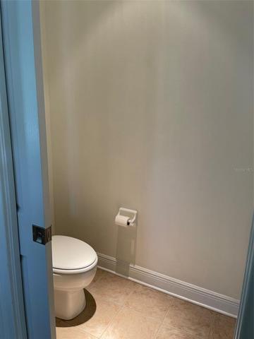 Pocket door opens to the commode.