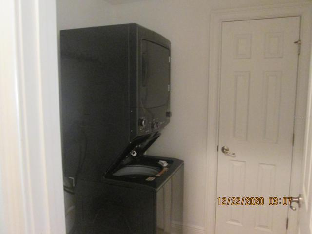 Downstairs laundry room...door opens to storage closet.