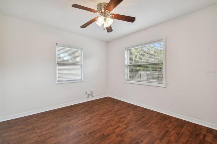 Bedroom 2 offers a backyard view