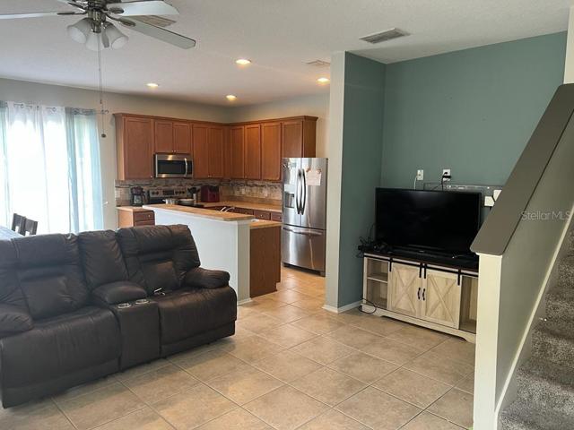 Living Room opens to Kitchen & Dining
