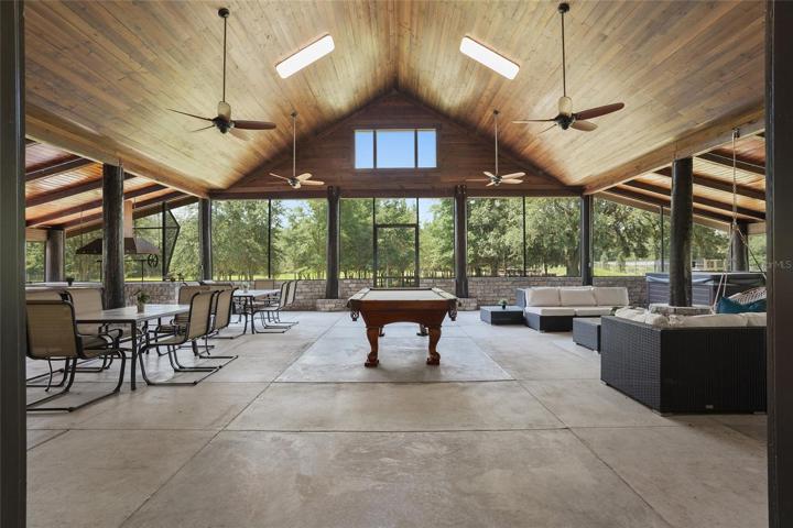 Screened-in back porch entertaining area