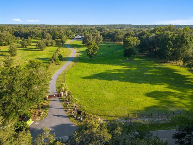 Private gated entry with winding road to home.