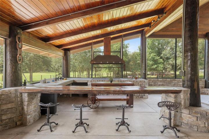 Outdoor Grill with rustic seating area