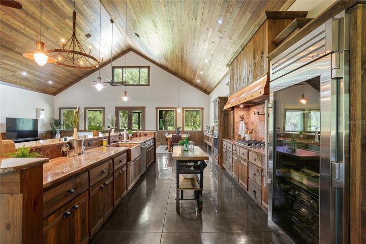Sprawling kitchen with high-end appliances and features.