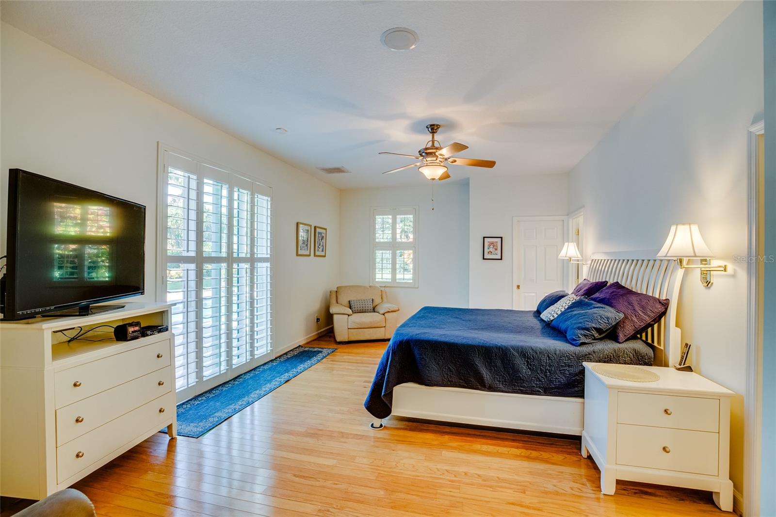 Master Bedroom with view of sliding glass doors to deck /pool