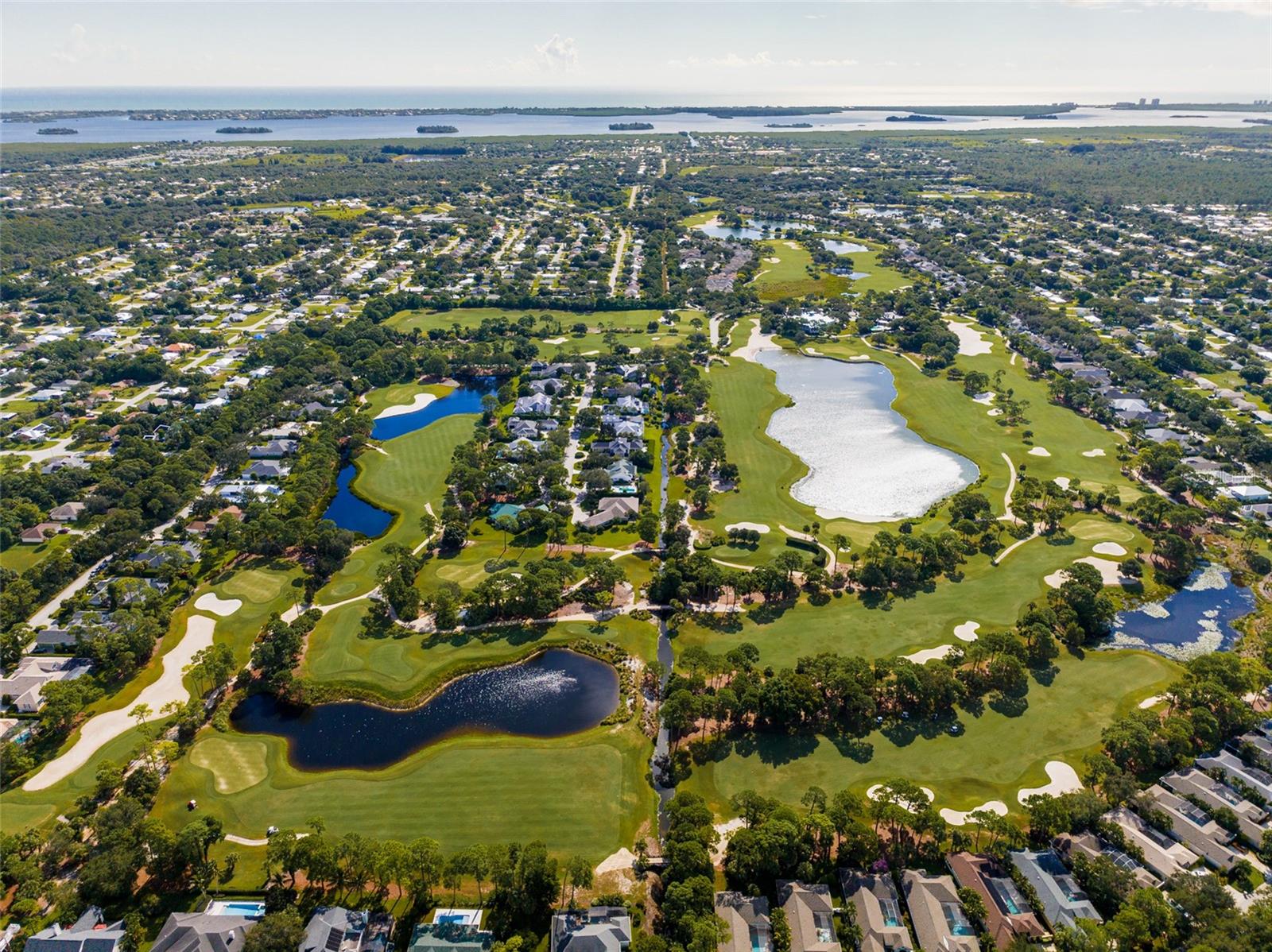 Aerial View of Golf Course with various holes and ponds