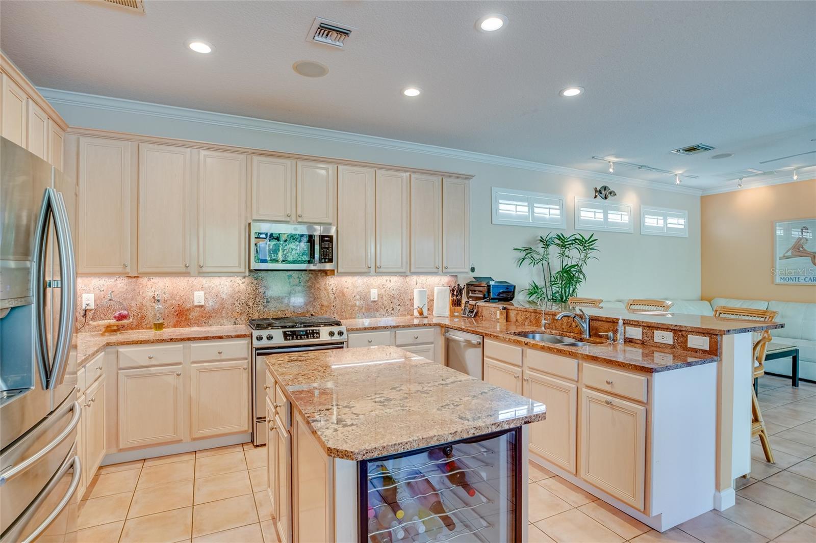 View of Kitchen layout with wine frig in island