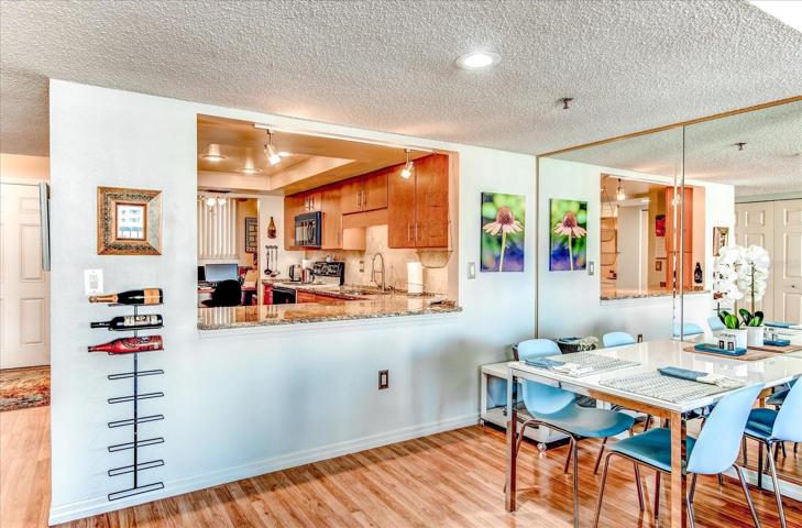 Dining room with kitchen access and bar area.