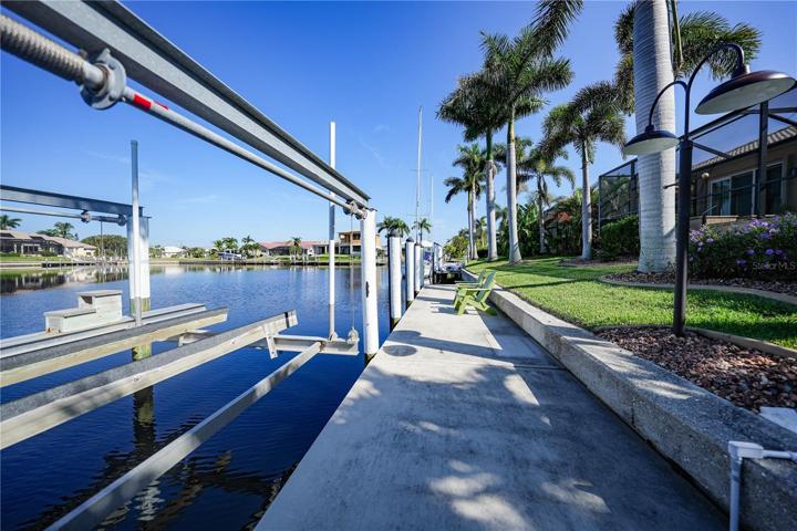 83Foot Seawall with 45 Ft Dock with Electric and Water. 10,000# boat lift