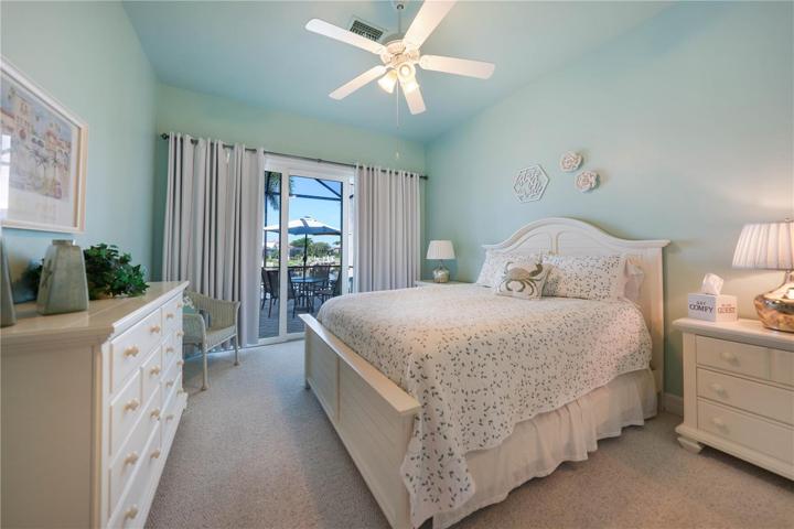 Main Guest Bedroom with sliders to lanai and pool