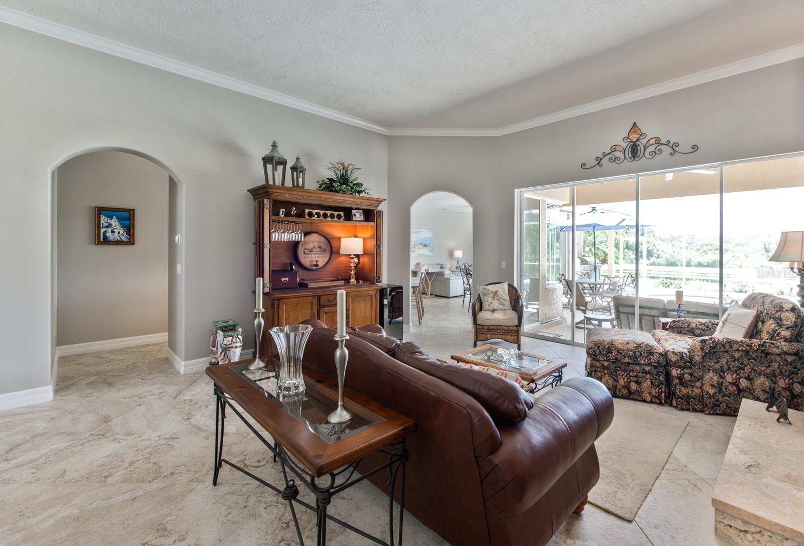 Looking toward the family room through the decorative archway of the living room.