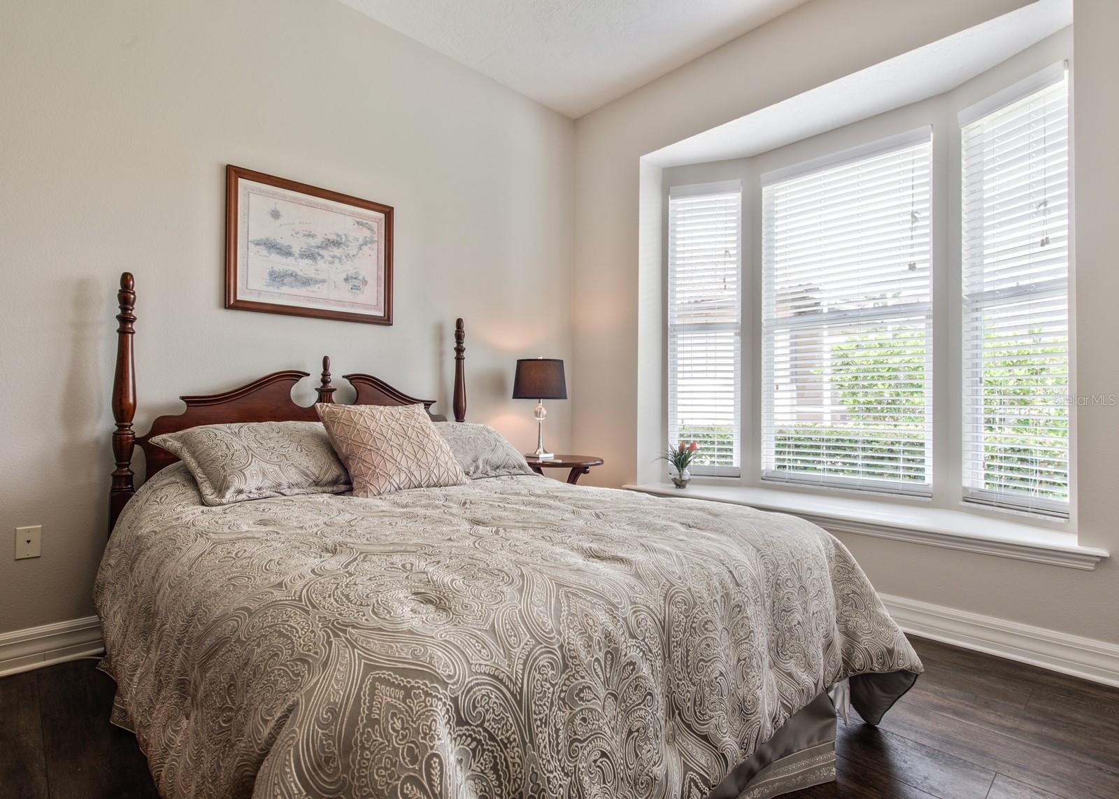 Bedroom 2 has new luxury vinyl plank flooring and a bay window seat.