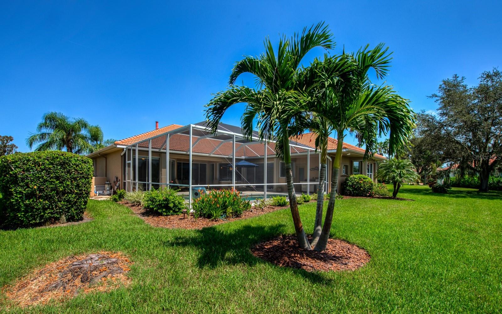 Palms, Hawaiian Ixoras, Bougainvillea and lovely Birds of Paradise are just a few of the plants and mature trees that give added beauty to this .31 acre homesite.