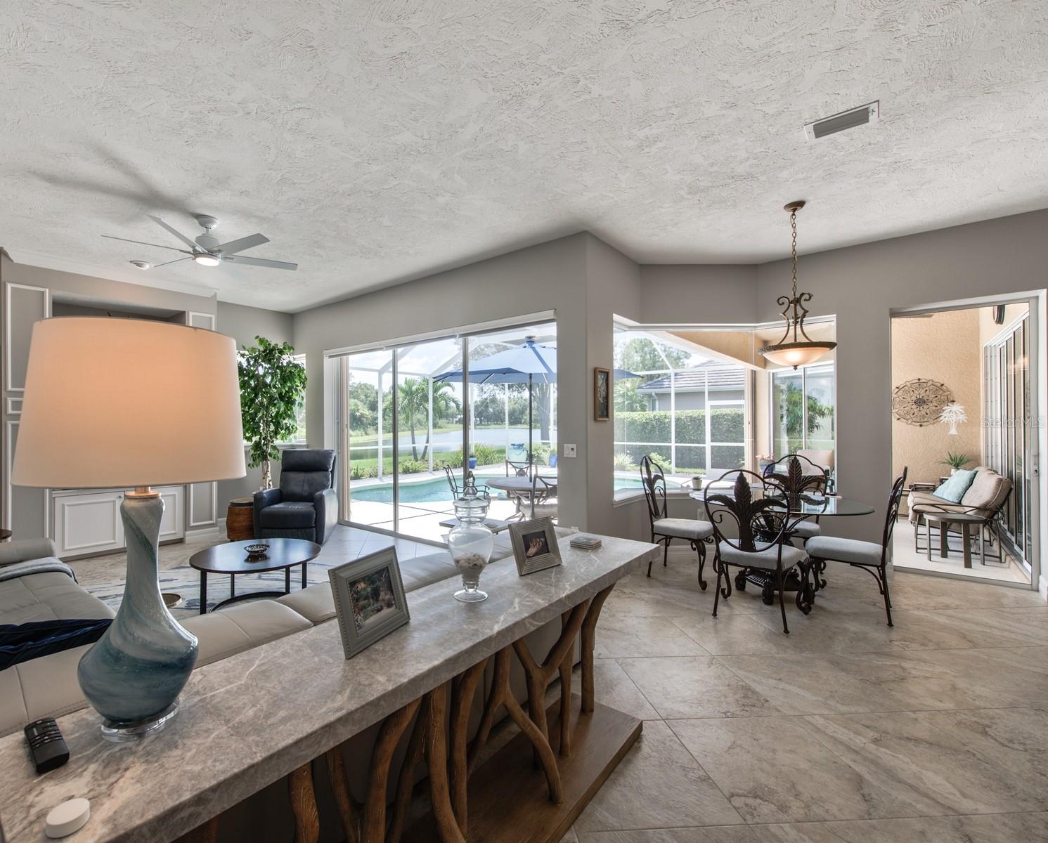 Triple glass sliding doors in the family room add natural light and beauty to the space. Views, views, views!
