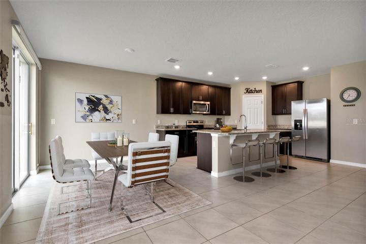 Solar panels help keep energy costs low, there are TILE FLOORS throughout the main living areas and the many windows let the natural light pour in! Virtually Staged.