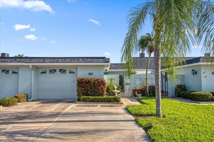 2 Car driveway and beautiful palm trees