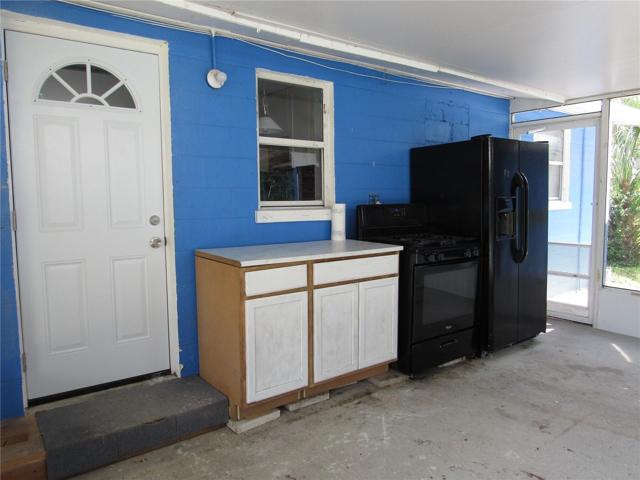 Screened porch with out-door cooking area.