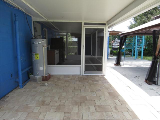 Covered patio with decorative pavers.