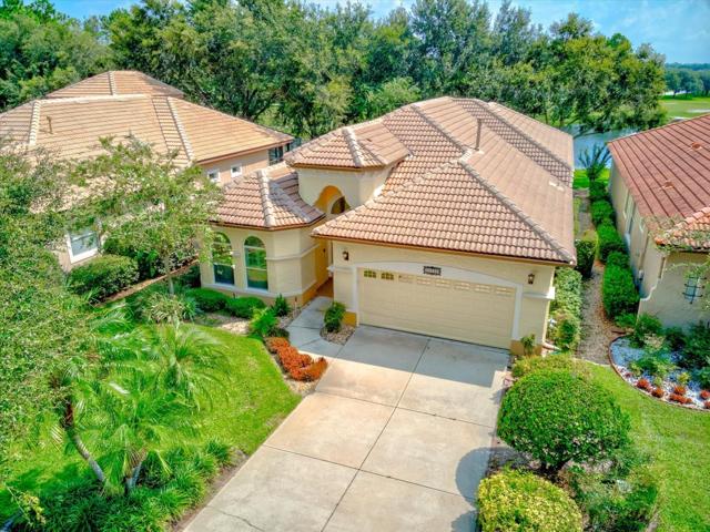 Front View of Home. Lush landscapes. Pond View