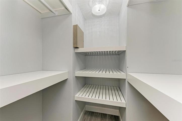 Master Closet with 4 sets of clothes hanging rods.