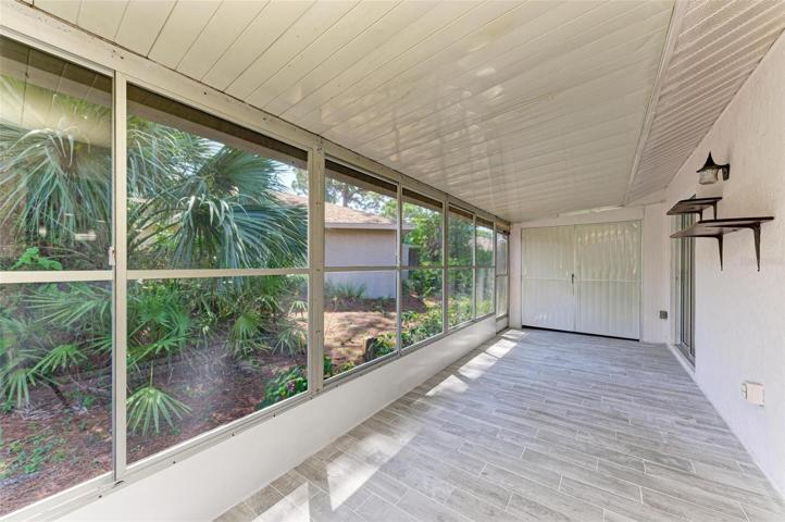 Huge tiled lanai with sliding windows.  Nice size storage at the end with double doors to open fully.