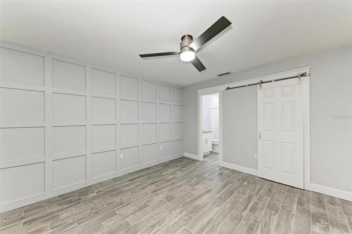 Solid core, 6 panel "Barn Door" coving the master closet