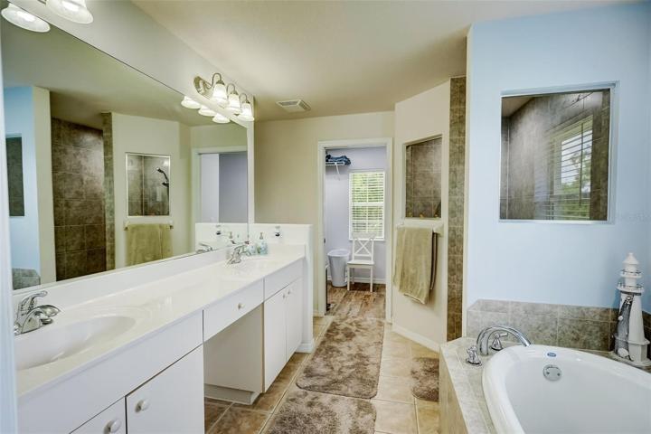 Ensuite Master Bathroom with dual vanities, large soaking tub, and walk-in shower!