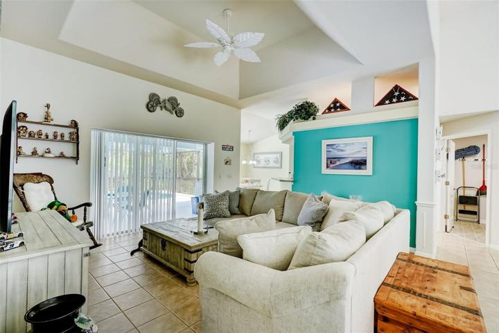 Living Room with Tray Ceiling and Pool View!