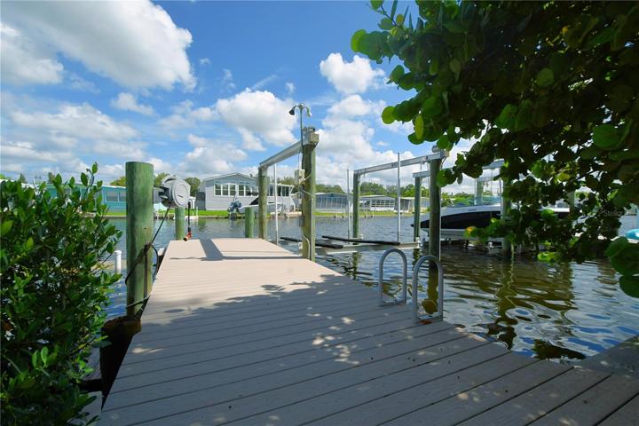 A boater's dream, the property is equipped with a private dock, and a 10,000 lb boat lift.