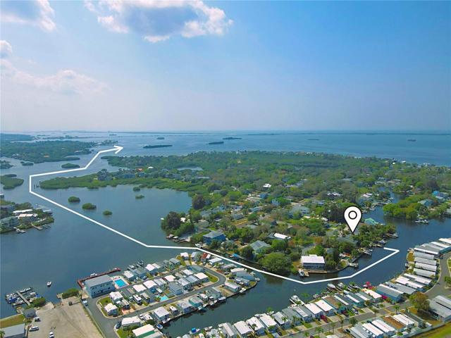 Embrace the coastal allure of this three-bedroom, one-bath paradise that promises the epitome of waterfront living with direct open-water access.