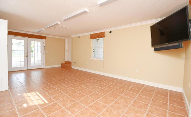 The multi-purpose room, a spacious 13 x 23 haven, is accentuated with French doors that guide you directly to the resort-inspired pool area.