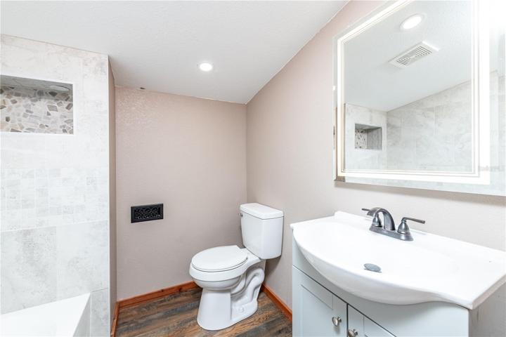 Upstairs bathroom completely remodeled with new vanity, toilet, shower with shelf lights, mirror with lighting and defrost mode.