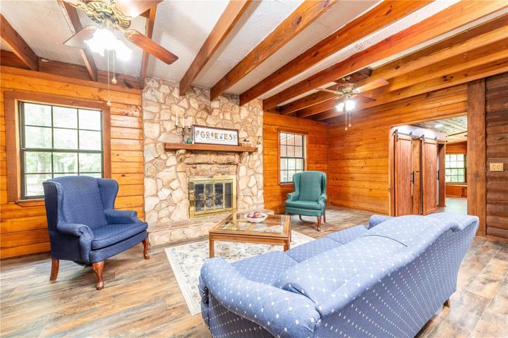 This living area is right off of the kitchen and could be used as a large dining room with a fireplace.