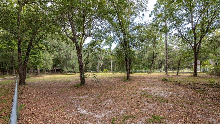 1 acre is fully fenced with chain link fencing.