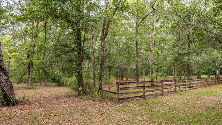 Partially fenced with 4 board fencing.