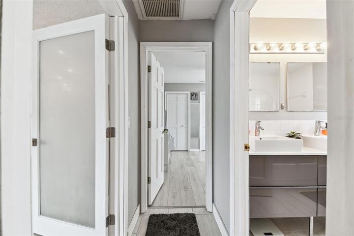 Hallway to bath on right, eat in area to left and Bed 2 straight ahead