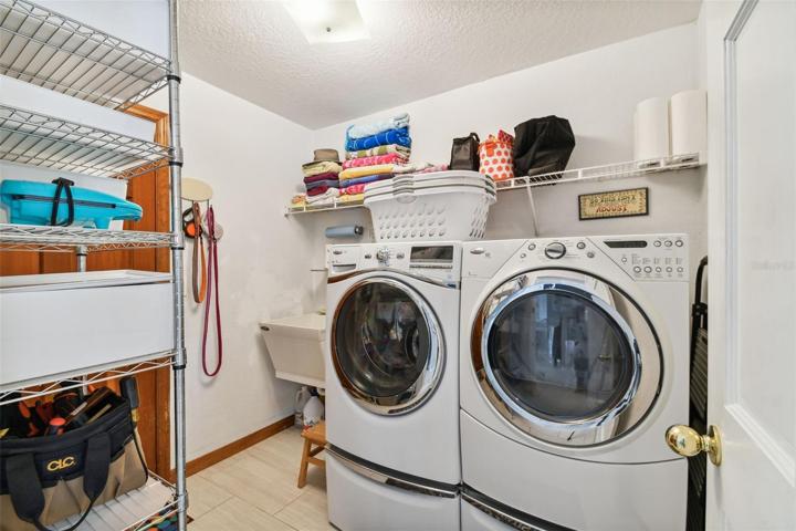 Laundry off garage with utility tub