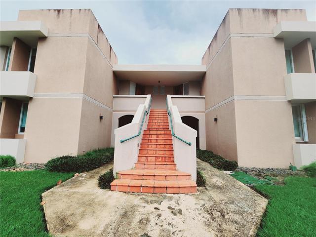 Entrance of the building where the apartment is located at your right.