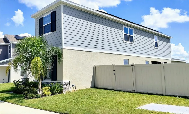 Exterior- right side is fenced in.