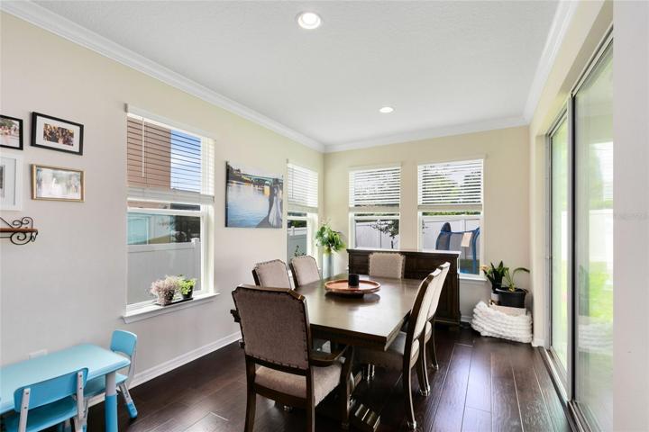 Sliders from the dining and living areas open to the tranquil covered lanai.