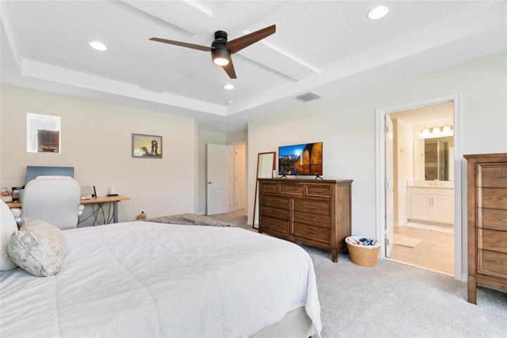 Graced by a coffered ceiling that adds a touch of elegance.