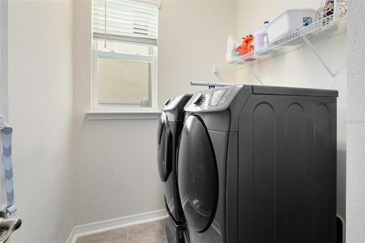 The laundry room is located down a hallway just off the main living areas.