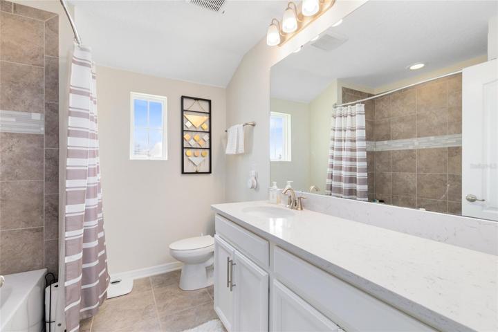 Second floor full bath with a tub/shower combo.