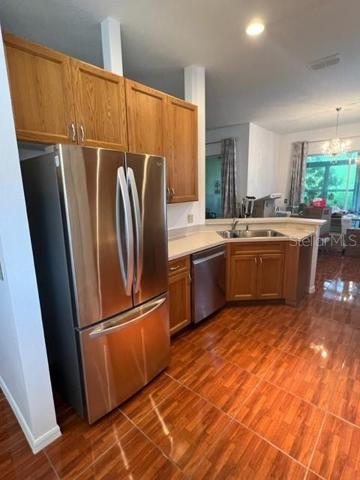 NEW STAINLESS-STEEL REFRIGERATOR.