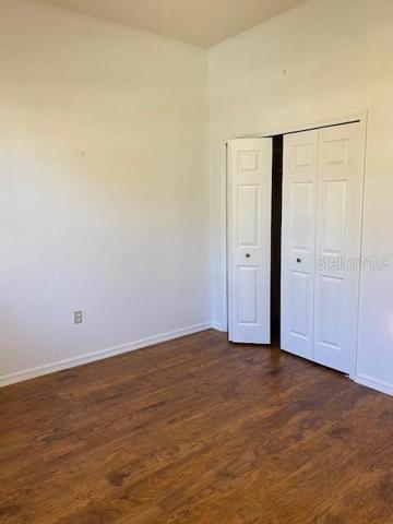 2ND BEDROOM WITH WOOD FLOORS.
