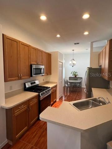 FROM DINING ROOM LOOKING INTO KITCHENETTE.