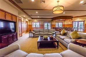 19TH HOLE WITH LARGE SCREEN TV, LIBRARY AND BAR (BYO).