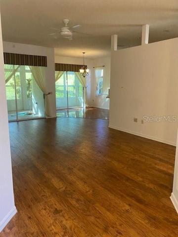 FROM FRONT DOOR LOOKING THROUGH LIVING ROOM INTO DINING ROOM.