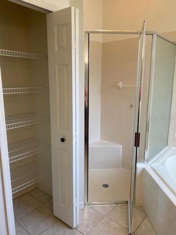 MASTER BATH WITH LINEN CLOSET, GARDEN TUB AND SEPARATE SHOWER.
