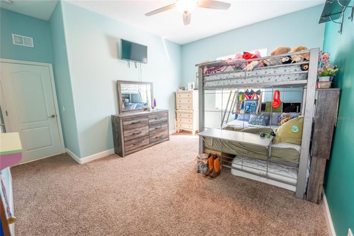 BEDROOM 2 ~ LARGE L-SHAPED WALK IN CLOSET WITH EXTRA STORAGE